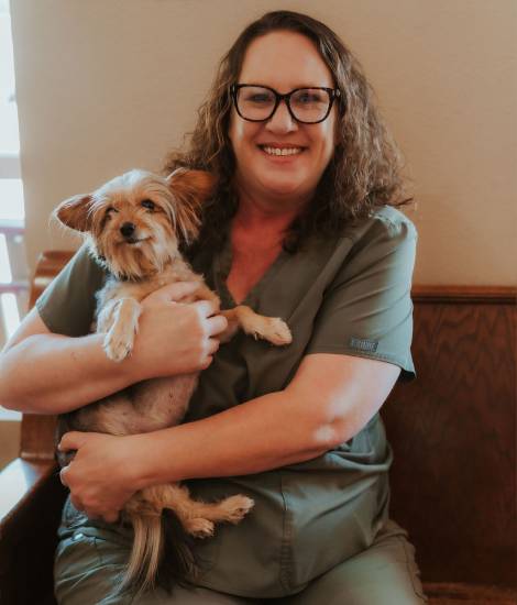 women holding a pet