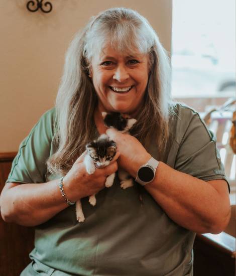 staff with pet smiling